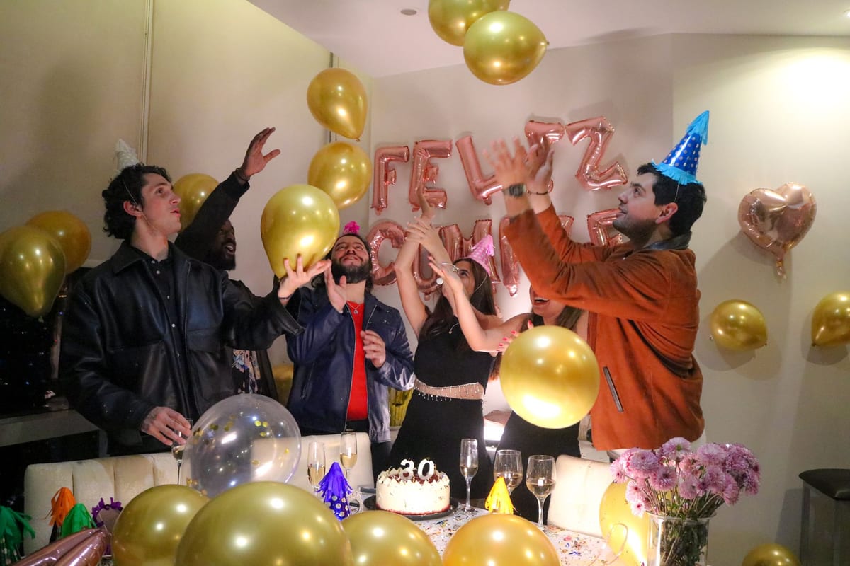 30th birthday gifts with celebration balloons and confetti