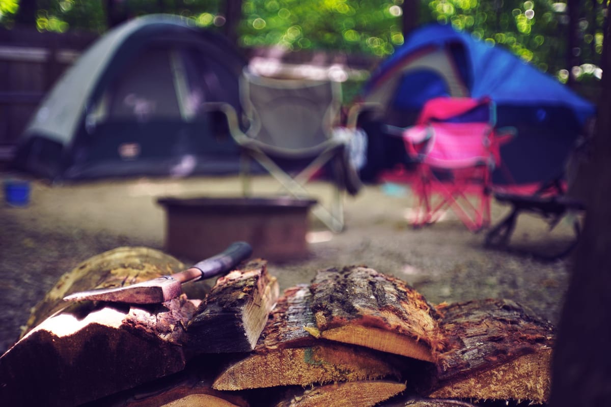The best camping gifts including gear laid out at a campsite