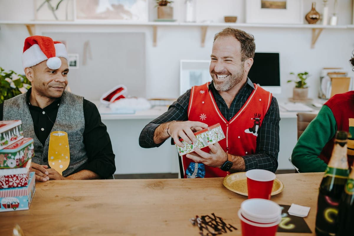 Coworkers exchanging gifts in the office