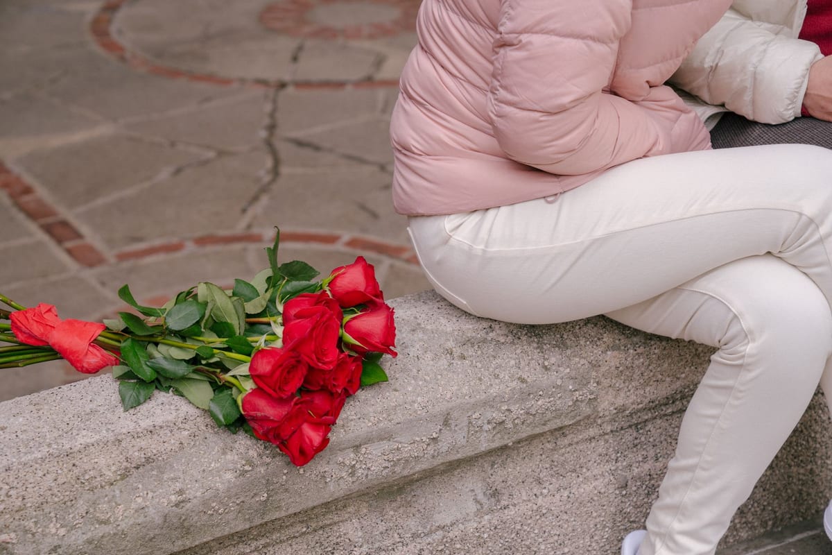 A thoughtful gift for a girlfriend with flowers and a present